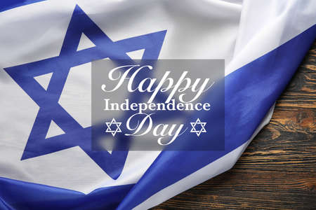Greeting card for Israel Independence Day with flag on wooden backgroundの写真素材