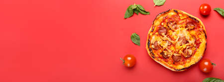 Delicious mini pizza on red background with space for textの写真素材