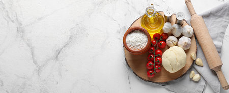Ingredients for pizza on light background with space for textの写真素材