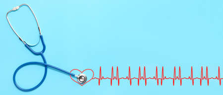 Stethoscope and drawn pulse on blue background. cardiology concept