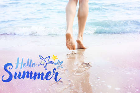 Legs of beautiful young woman on sea beach. hello summerの写真素材