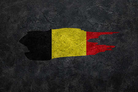 Painted flag of Belgium on dark grunge backgroundの写真素材