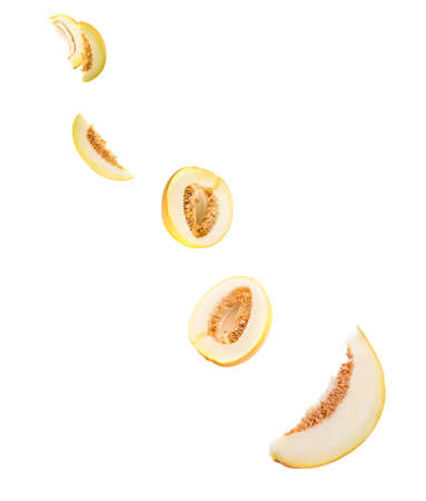 Flying cut melon isolated on whiteの写真素材