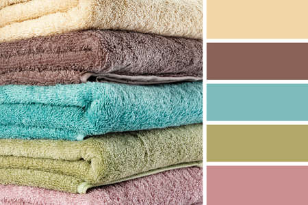 Stack of clean towels, closeup. Different color patternsの写真素材
