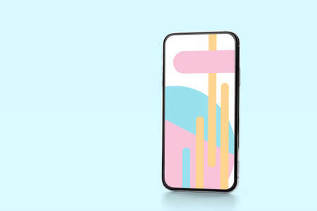 Modern smartphone on turquoise background