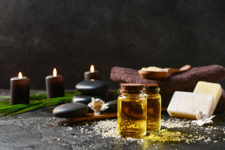 Bottles with essential oil on dark backgroundの写真素材