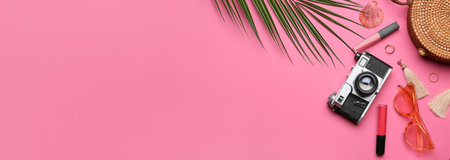 Woman's accessories, cosmetics, photo camera and palm leaf on pink background with space for text