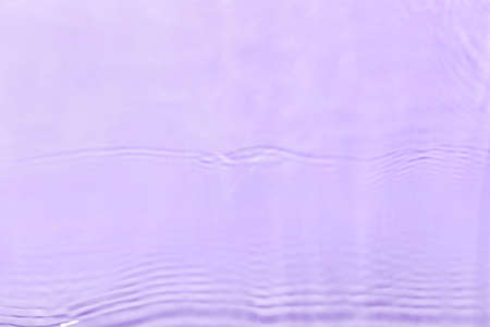 Clean water splashes on color background