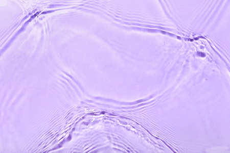 Clean water splashes on color background