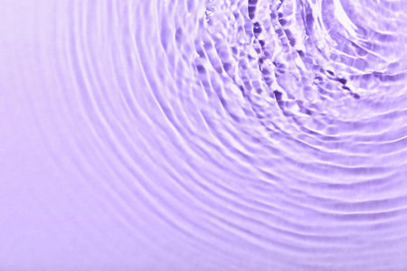 Clean water splashes on color backgroundの写真素材