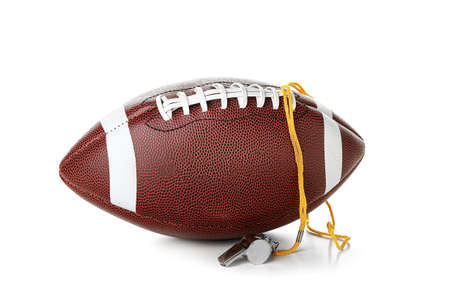 Rugby ball with sport whistle on white backgroundの写真素材
