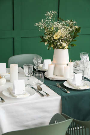 Stylish table setting for wedding celebration in dining room