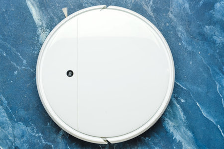 Robot vacuum cleaner on color backgroundの写真素材