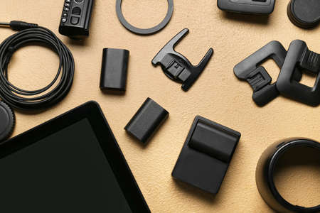 Photo equipment on beige background, top view