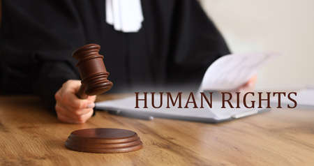 Female judge with gavel in courtroom. human rights