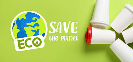 Blank cups on green background. Save the planet