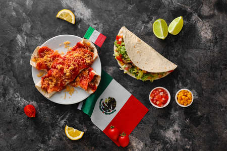 Composition with Mexican traditional food and flags on gray backgroundの写真素材