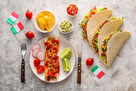 Composition with Mexican traditional food and flags on gray backgroundの写真素材