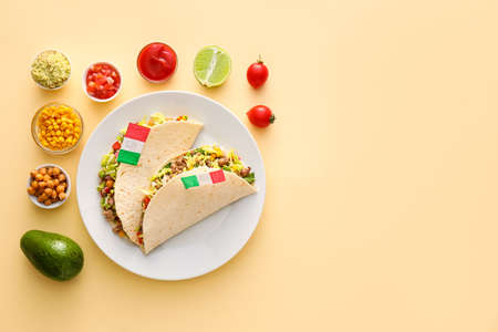 Composition with Mexican traditional food and flags on beige backgroundの写真素材
