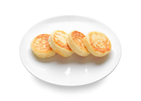 Plate with cottage cheese pancakes on white backgroundの写真素材