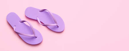 Stylish flip-flops on pink background with space for textの写真素材