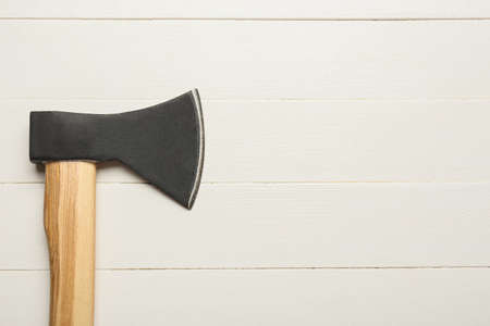 Ax on white wooden backgroundの写真素材