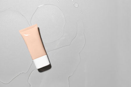 Makeup foundation in water on gray backgroundの写真素材