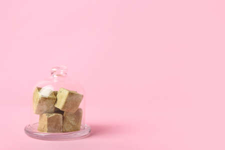 Tasty hojicha marshmallows on pink background