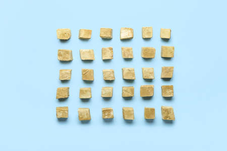 Tasty hojicha marshmallows on blue background