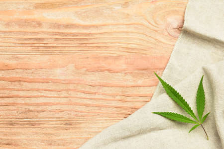 Hemp cloth on wooden backgroundの写真素材