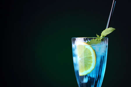 Glass of Blue cocktail on dark backgroundの写真素材