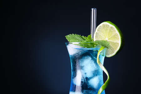 Glass of Blue cocktail on dark backgroundの写真素材
