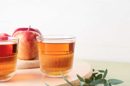Glasses of tasty apple juice on table, closeupの写真素材