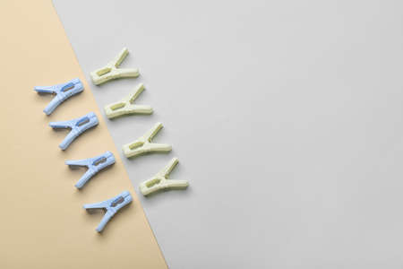 Plastic clothes pins on light background