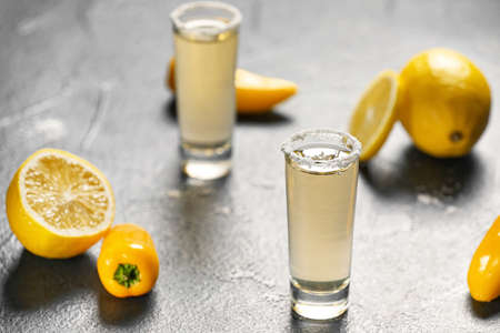 Shots of tasty mexican tequila on dark backgroundの写真素材