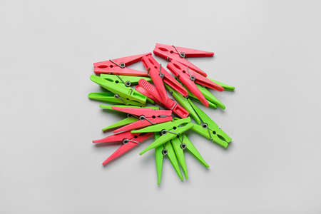 Plastic clothes pins on gray backgroundの写真素材