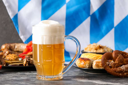 Mug of fresh beer on table. Oktoberfest celebration