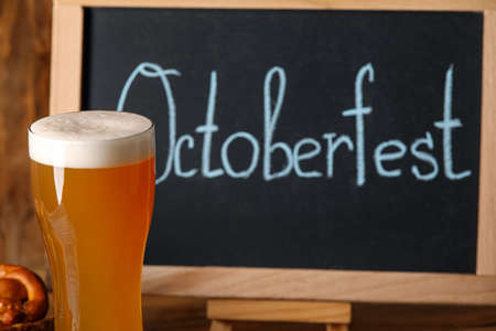 Glass of fresh beer on table, closeup. Oktoberfest celebrationの写真素材