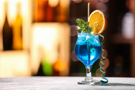 Glass of Blue cocktail on table in barの写真素材