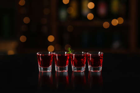 Shot cocktails on table in bar