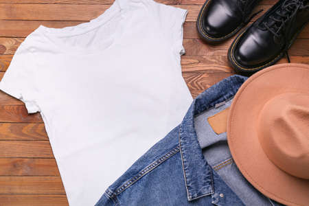 Stylish female clothes, hat and shoes on wooden background, closeupの写真素材
