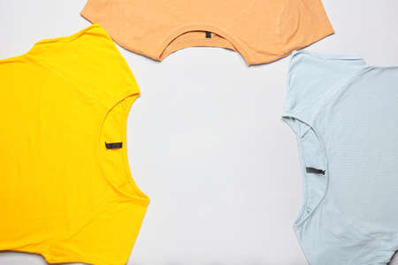 Different t-shirts isolated on white background, closeup