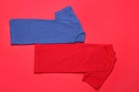 Two t-shirts on red backgroundの写真素材