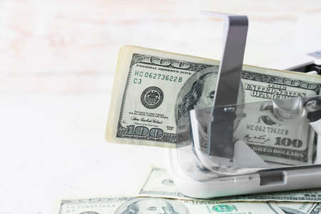 Dollars in currency counting machine on light background, closeupの写真素材
