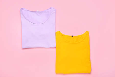 Stylish t-shirts on pink background