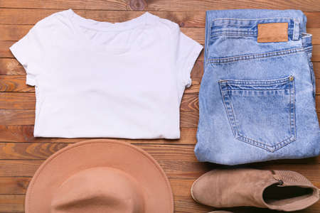 Stylish female clothes and shoes on wooden background, closeupの写真素材