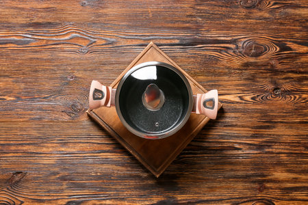Cooking pot with lid on wooden backgroundの写真素材