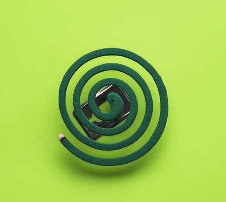 Mosquito spiral on green backgroundの写真素材