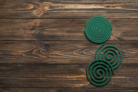 Mosquito spirals on dark wooden backgroundの写真素材