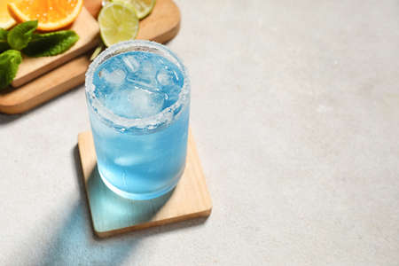 Glass of Blue cocktail on light background, closeupの写真素材